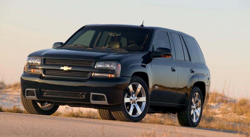 A black 2003 Chevy Trailblazer SS is shown from the front at an angle.