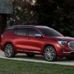 A red 2018 GMC Terrain Denali is shown from the front at an angle.