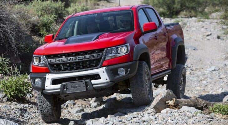 A red 2019 Chevy Colorado ZR2 Bison is shown from the front while off-road after leaving a dealer that has a Chevy Colorado for sale in Nashville.