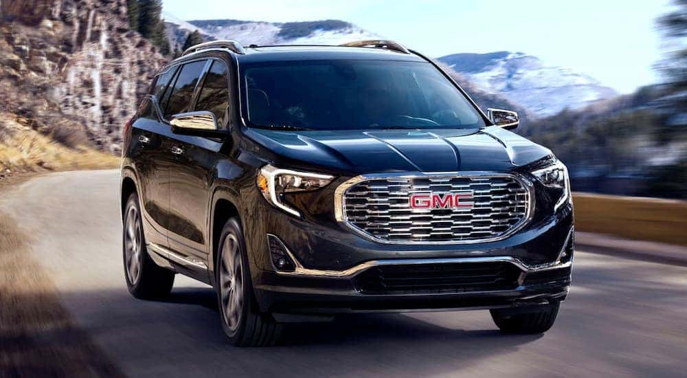 A black 2020 GMC Terrain driving.