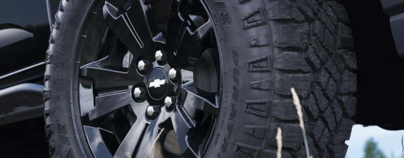 A close up of the black rim on a 2022 Chevy Colorado.