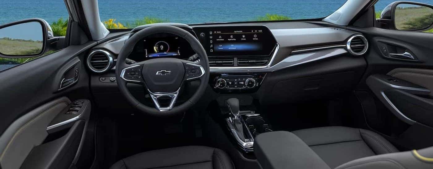 The black and gray interior and dash in a 2024 Chevy Trax ACTIV is shown.