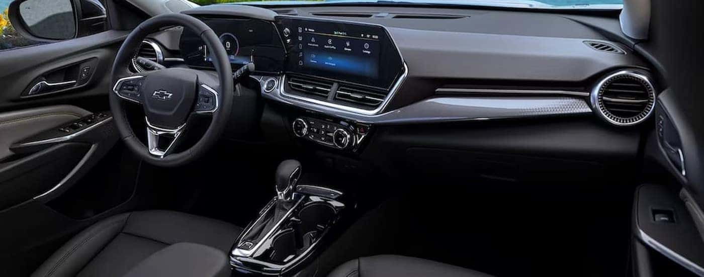 The black interior and dash in a 2024 Chevy Trax is shown.