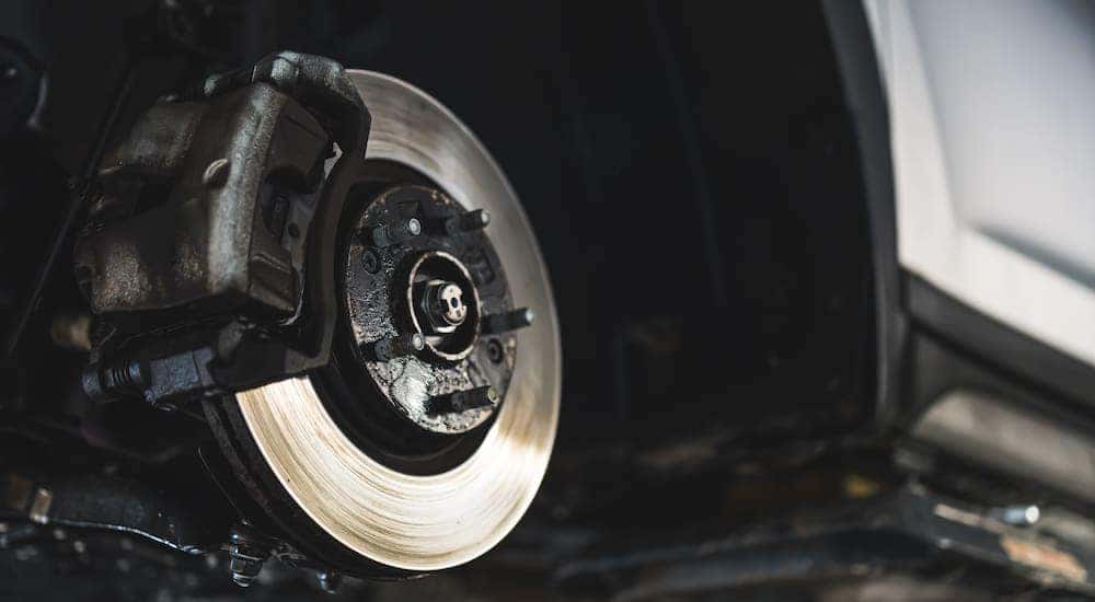 Close-up of the brake rotor on a car having brake work done.