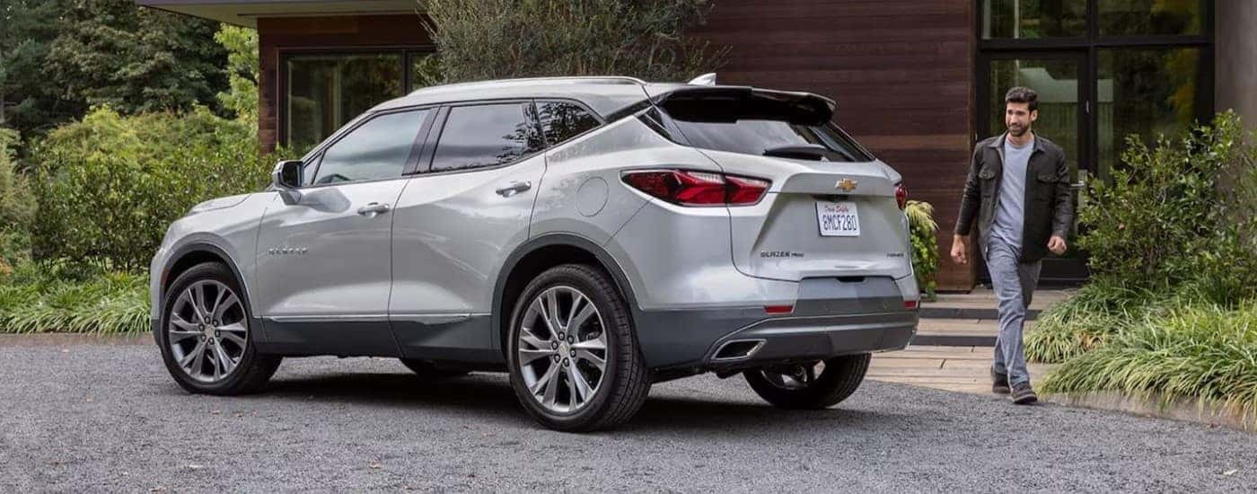 A silver 2021 Chevy Blazer is parked in a driveway.