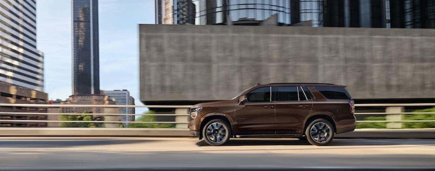 A brown 2022 Chevy Tahoe for sale in Dallas is shown from the side.