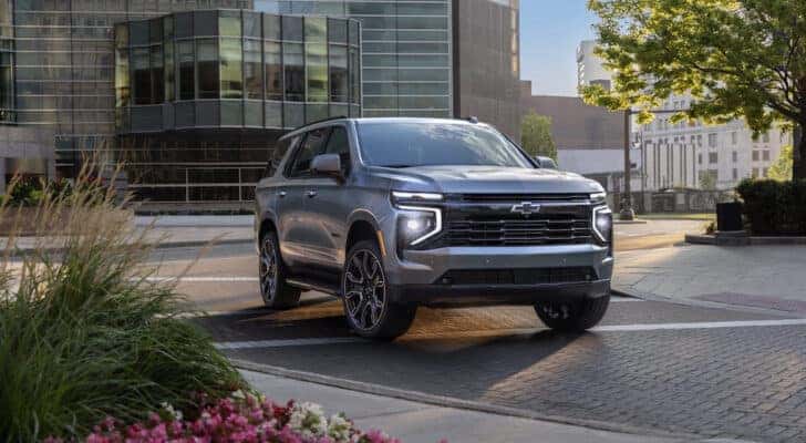 A silver 2025 Chevy Tahoe RST is shown from the front at an angle.