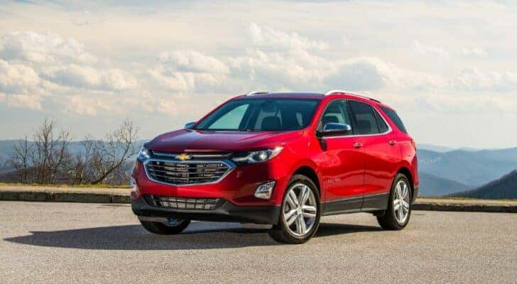 A red 2020 Chevy Equinox parked and angled left.