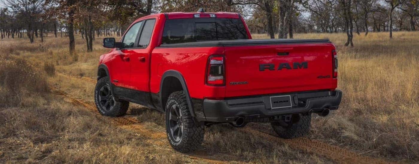 A red 2022 Ram 1500 Rebel is shown parked off-road.
