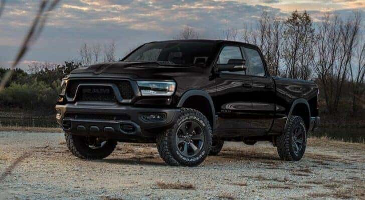 A black 2020 Ram 1500 Rebel parked on the beach.