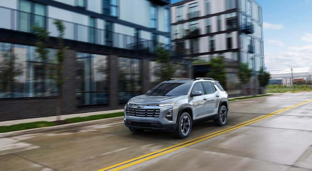 A silver 2025 Chevy Equinox is shown from the front at an angle.