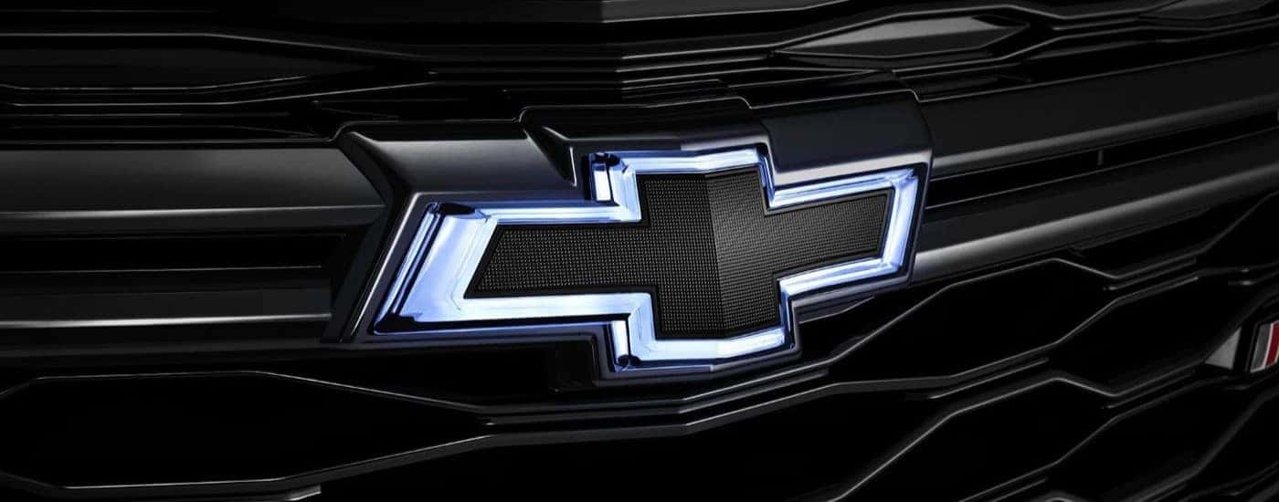 A close-up on the black grille and Chevy emblem of a Chevy Equinox for sale in Indianapolis.