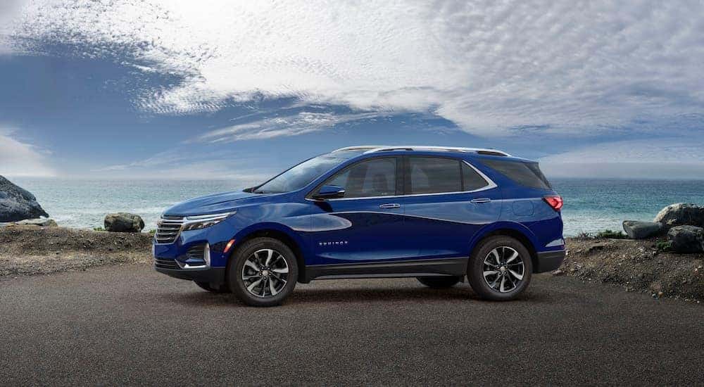 A blue 2023 Chevy Equinox for sale in Indianapolis is shown from the side.