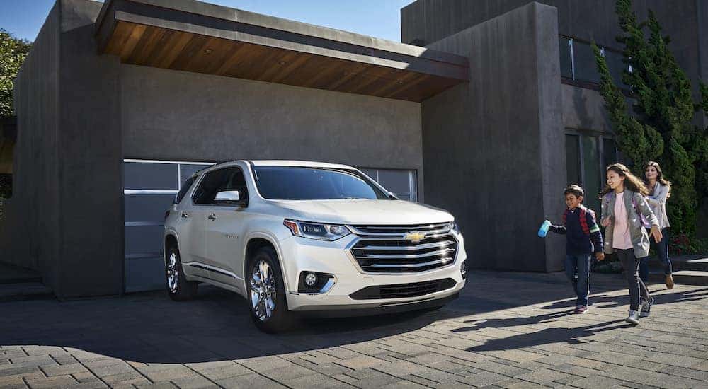 A white 2021 Chevy Traverse is shown from the front at an angle.