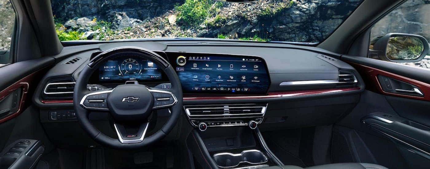 The black interior of a 2024 Chevy Traverse Z71 is shown from the driver's seat.