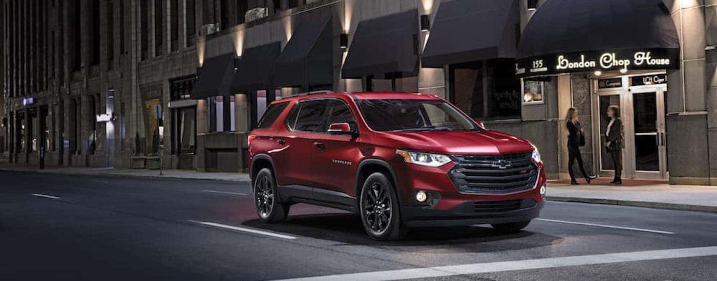 A red 2021 used Chevy Traverse for sale is shown from the front at an angle.