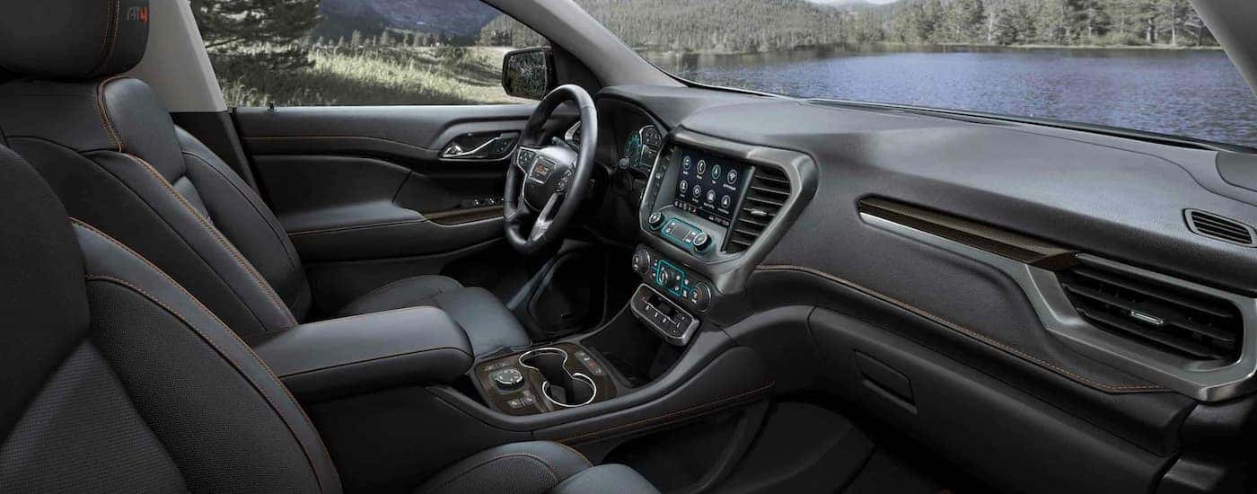 Side view of the dashboard of a 2023 GMC Acadia for sale.