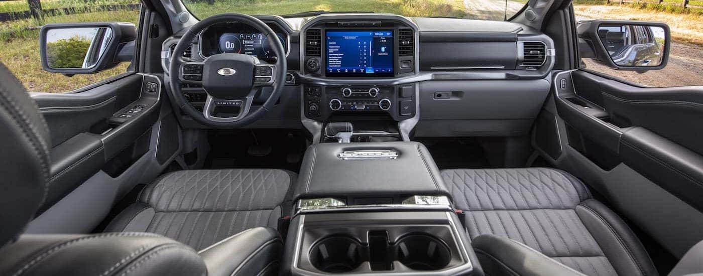 The black interior of a 2023 Ford F-150 Limited is shown from above the center console.