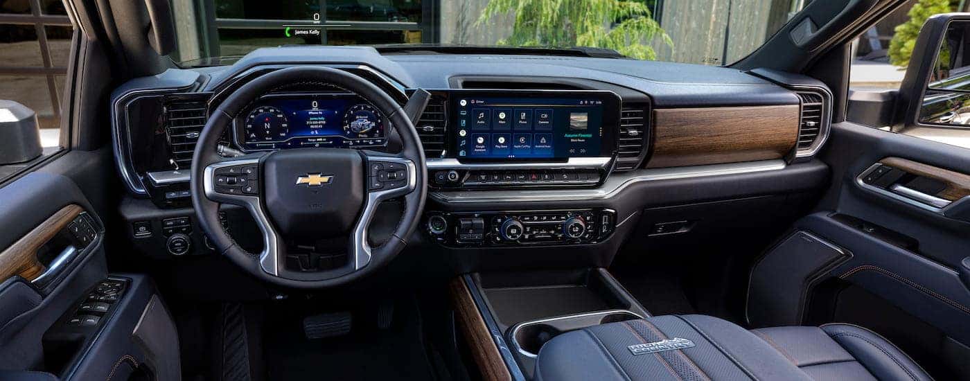 The interior of a 2024 Chevy Silverado 3500 HD High Country is shown from the driver's seat.