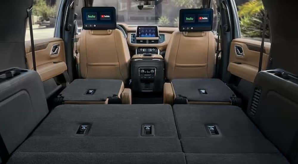 The black and tan interior is shown in a 2023 Chevy Suburban.
