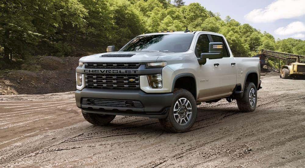 A white 2023 Chevy Silverado 2500 for sale is shown from the front at an angle.