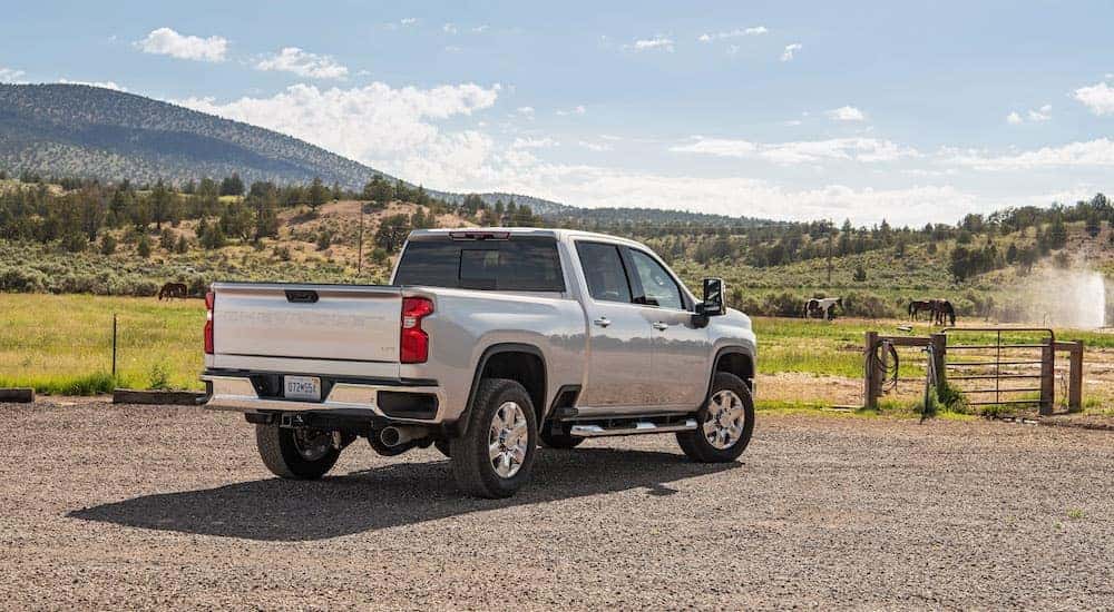 A silver 2023 Chevy Silverado 2500 is shown from the rear.