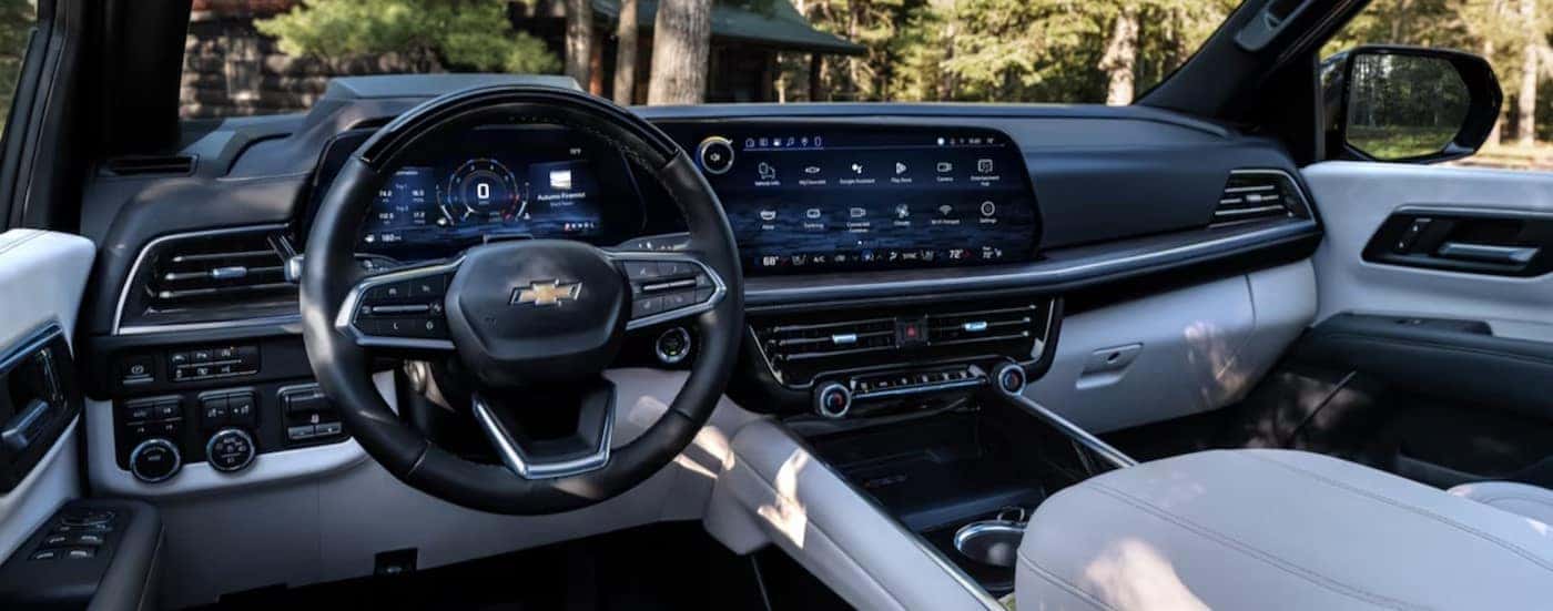 The black and white interior and dash are shown in a 2025 Chevy Suburban for sale in Nashville.
