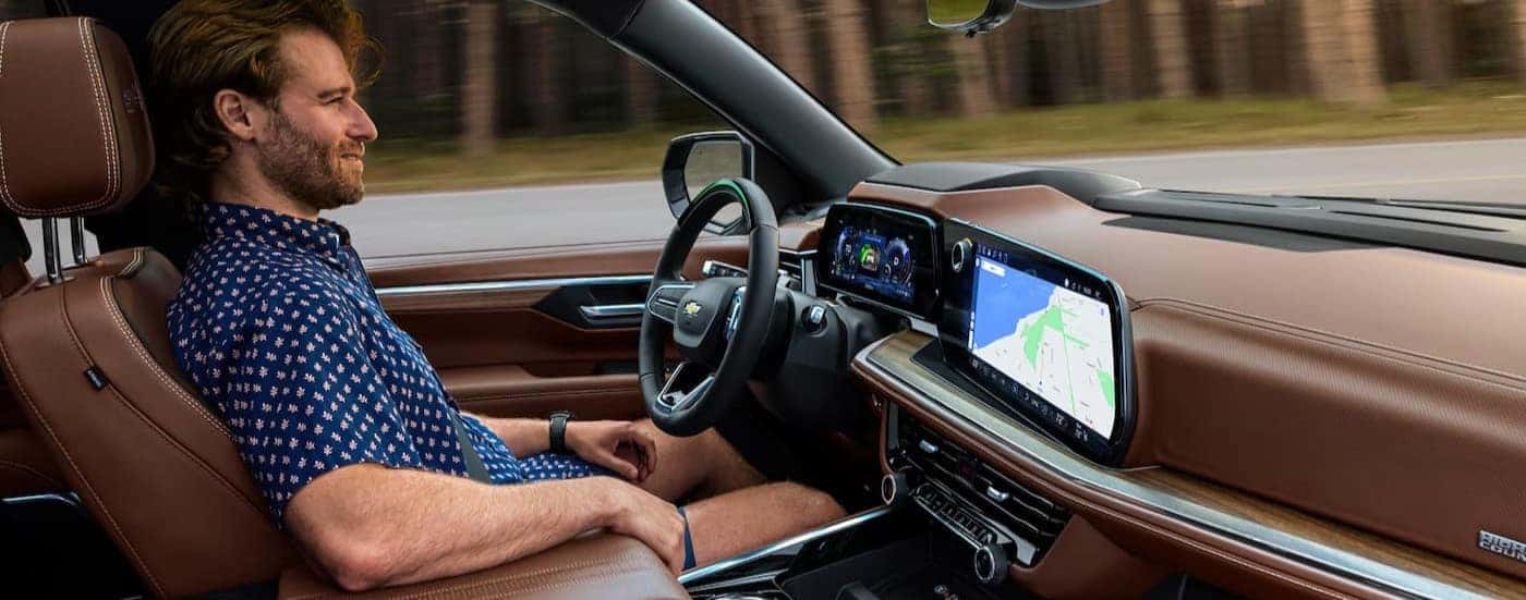The brown interior and dash are shown in a 2025 Chevy Suburban for sale in Dallas.