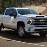 A white 2024 Chevy Silverado 2500 for sale is shown from the front at an angle.