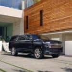 A grey 2022 Chevy Suburban for sale in Dallas is shown from the front at an angle.