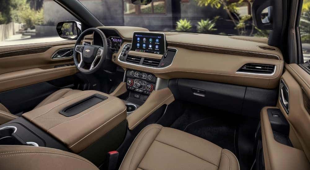The tan interior of a 2021 Chevy Suburban is shown.