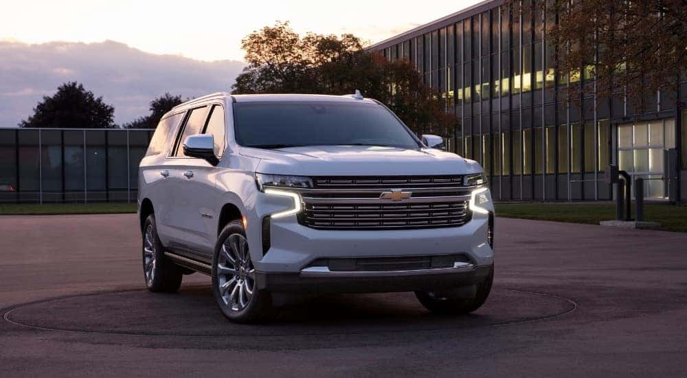 A white 2021 Chevy Suburban for sale in Columbus is shown from the front at an angle.