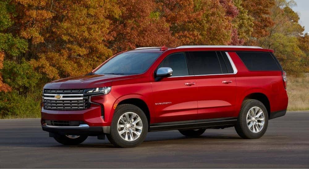 A red 2022 Chevy Suburban for sale in Nashville is shown from the side.
