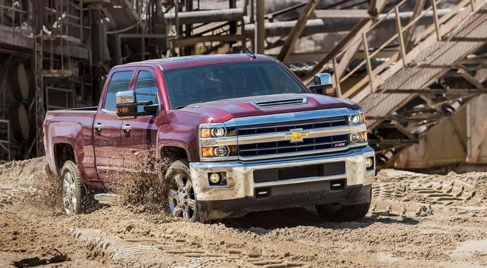 A purple 2019 Chevy Silverado 2500 HD Z71 is kicking up dirt.
