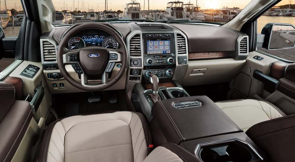 The multi-colored colored interior and dash in a 2016 Ford F-150 Limited.