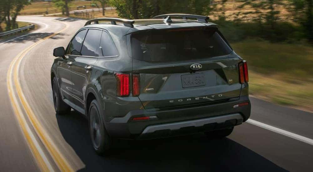 A gray 2021 Kia Sorento driving on a highway.