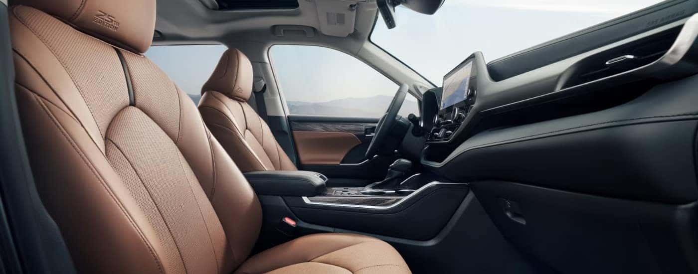 The brown interior of a 2025 Toyota Highlander.