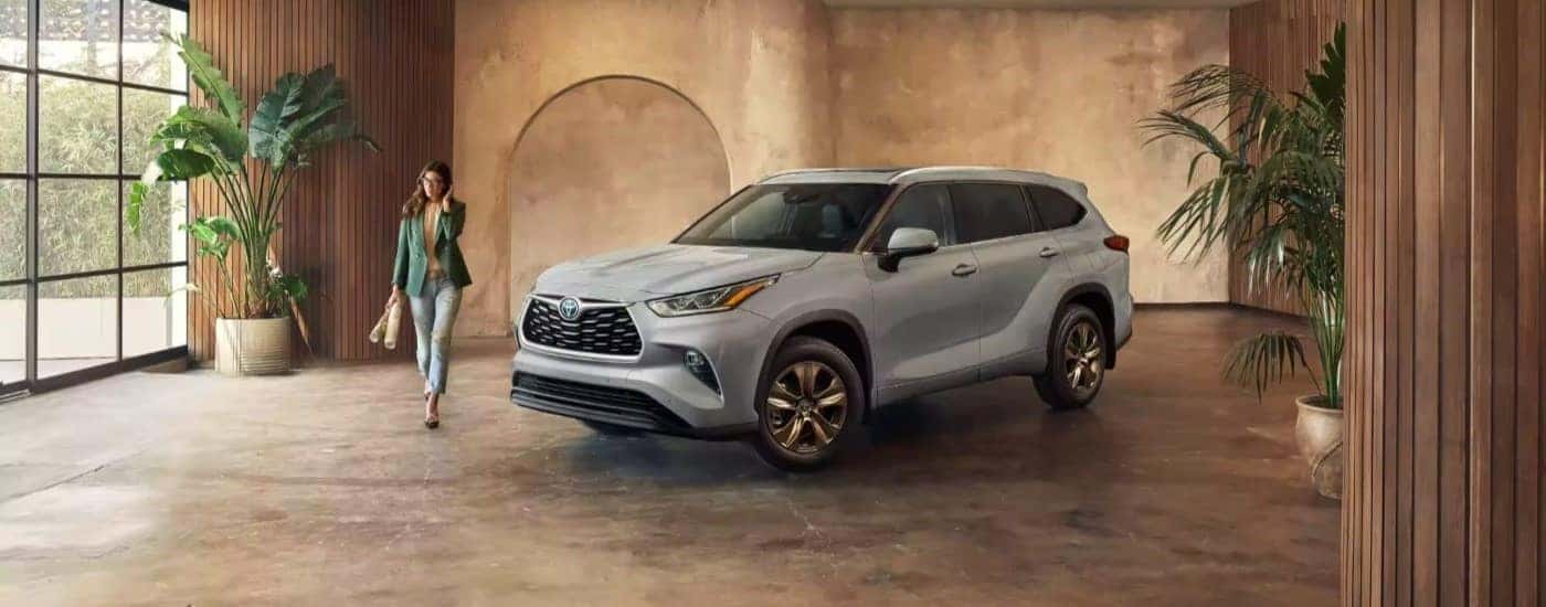 A used 2023 Toyota Highlander for sale parked indoors.