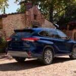 A blue 2023 Toyota Highlander from the rear.