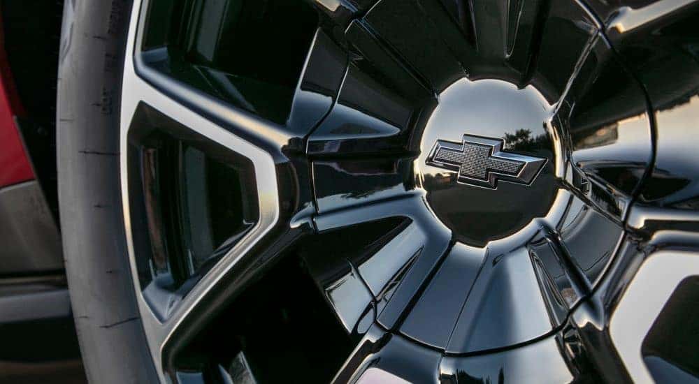 Close-up of a tire with black rim on a 2021 Chevy Tahoe