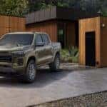 A green 2023 Chevy Colorado parked in a driveway