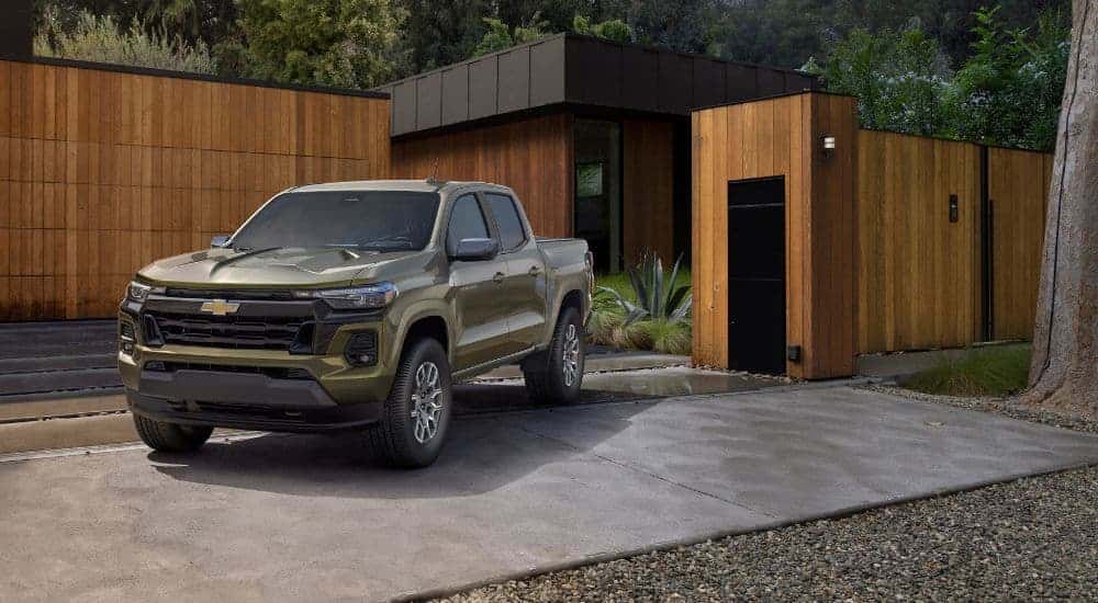 A green 2023 Chevy Colorado parked in a driveway