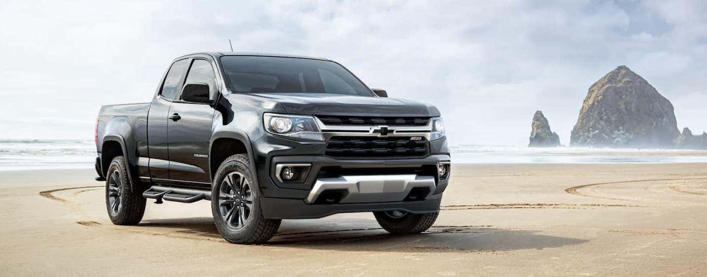 A gray 2023 Chevy Colorado Z71 parked on a beach.