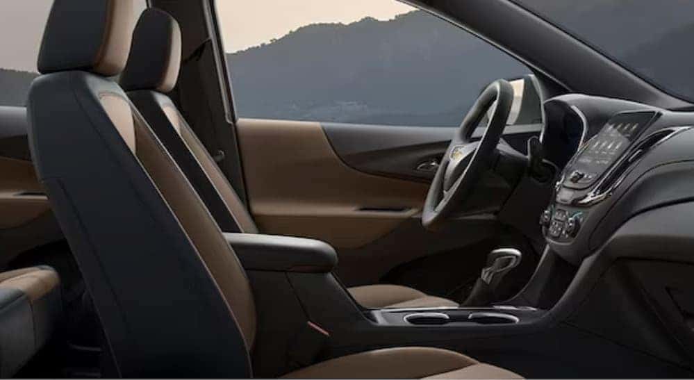 The black and brown interior and dash in a 2024 Chevy Equinox for sale.