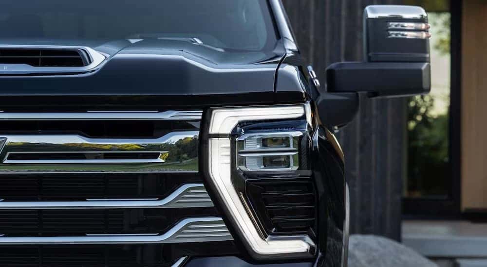 Front grille of a black Chevy Silverado 2500 for sale in Columbus