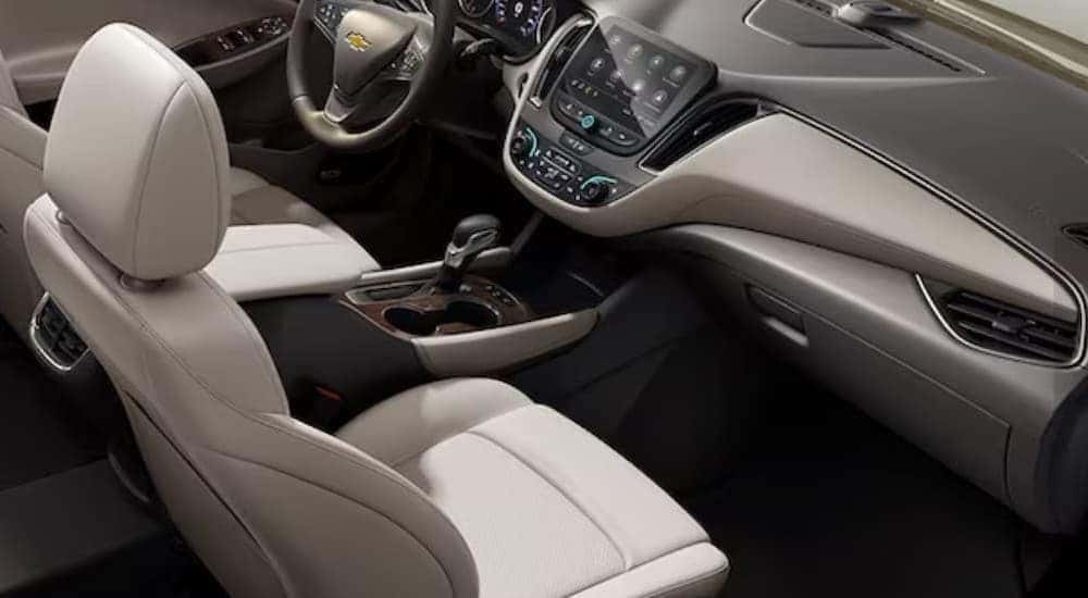 The gray and white interior and dash in a 2024 Chevy Malibu for sale.