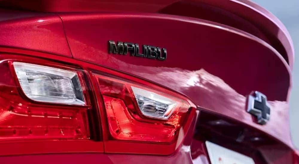 Close-up of the rear-end on a red 2024 Chevy Malibu.