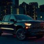 A black 2024 Chevy Silverado 1500 from the front at an angle.