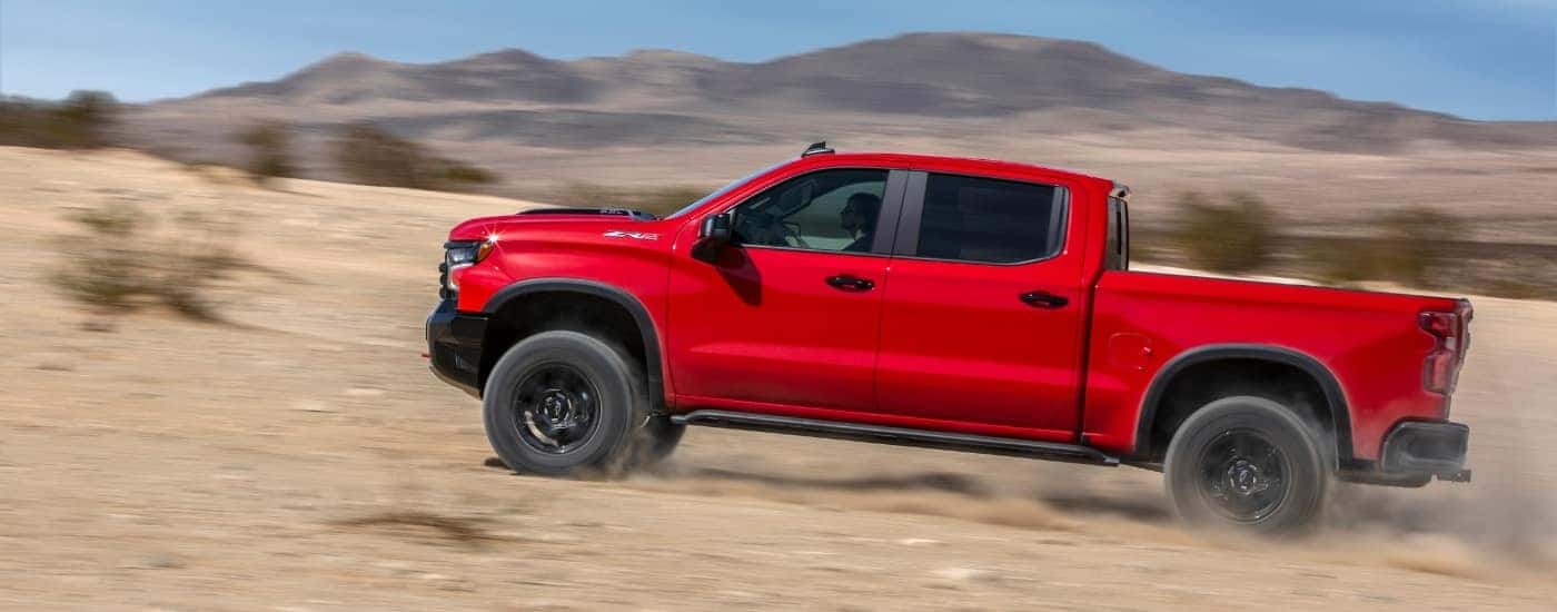 A red 2024 Chevy Silverado 1500 ZR2 from the side.