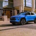 A blue 2025 Chevy Trailblazer parked on a city street